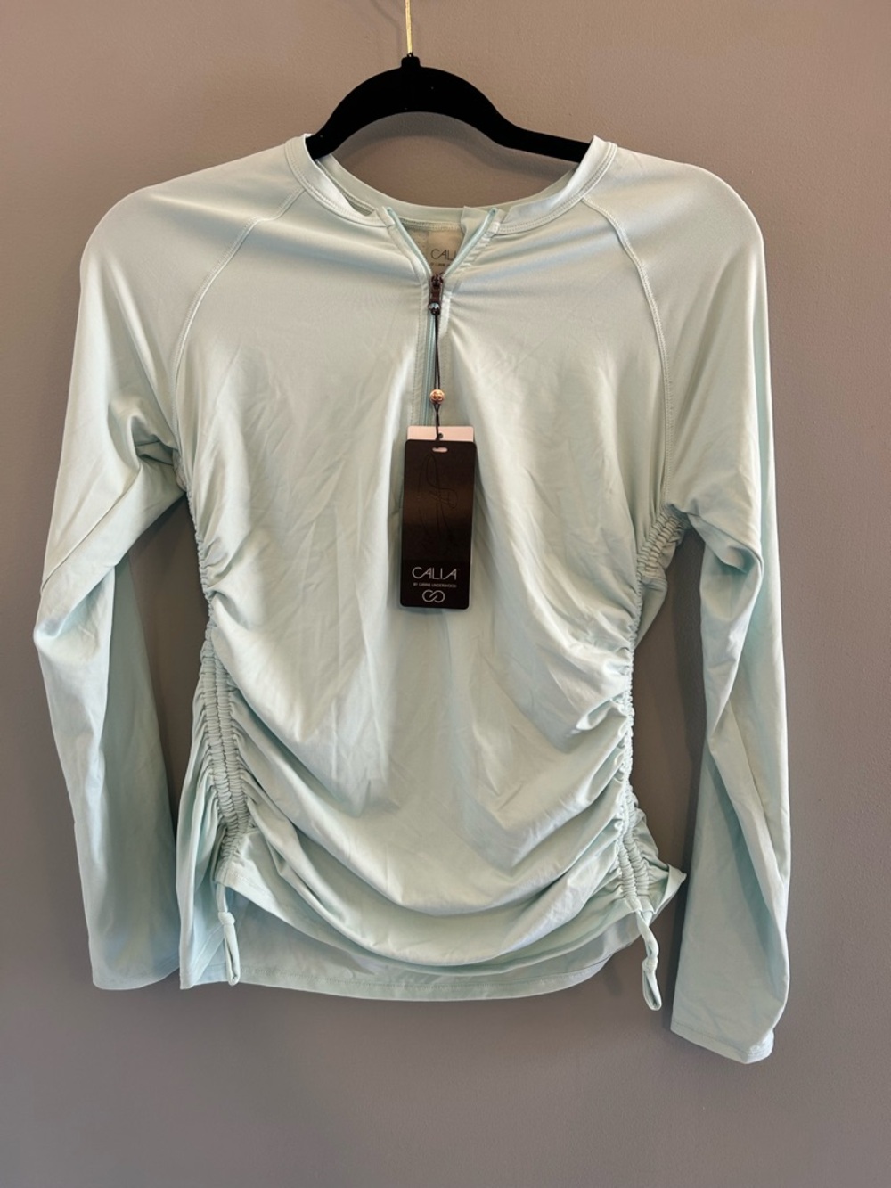 NWT Calia by Carrie Underwood LONG SLEEVE ZIP UP RASH GUARD
ICY BLUE size M